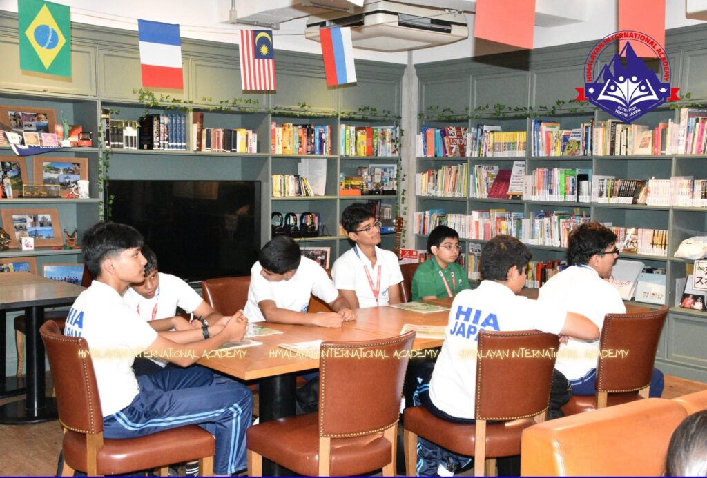 HIA students around a table in the university library