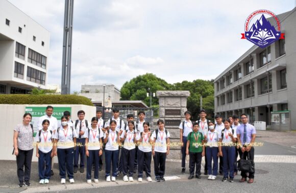HIA Grade 9 students and teachers outside the entrance of Chiba University of Commerce