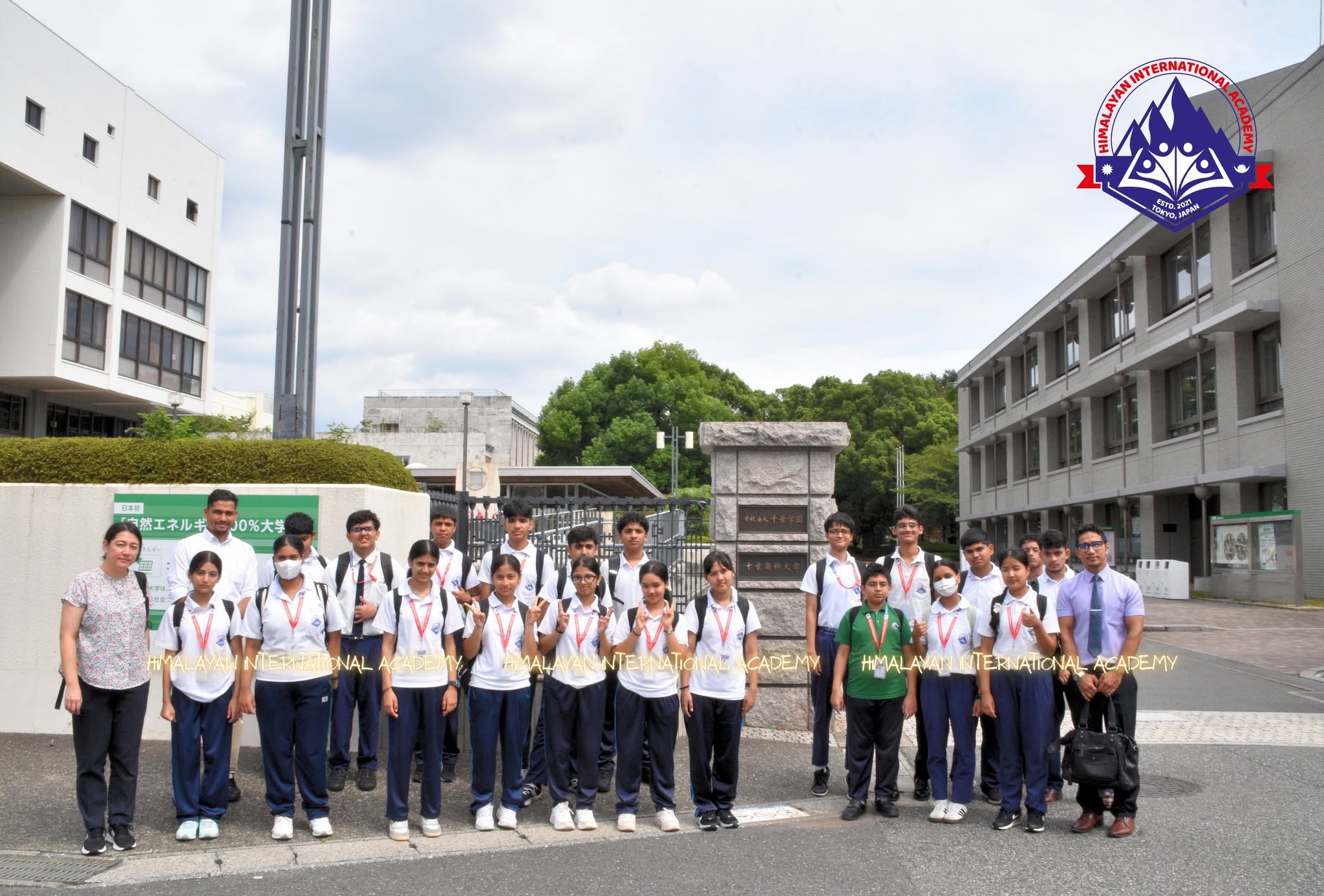 HIA Grade 9 students and teachers outside the entrance of Chiba University of Commerce